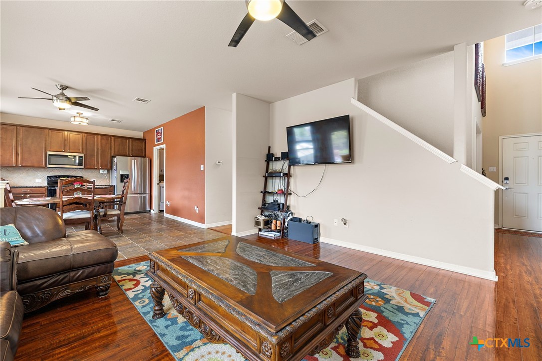 326 Comal Run Hutto, TX 78634 - Photo 11 of 23 a living room with furniture and a flat screen tv