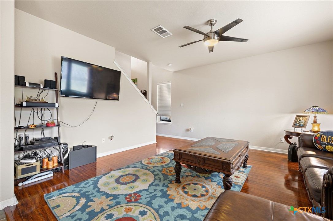 326 Comal Run Hutto, TX 78634 - Photo 12 of 23 a living room with furniture and a flat screen tv
