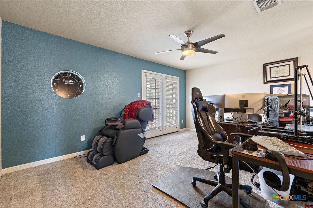 326 Comal Run Hutto, TX 78634 - Photo 19 of 23 a living room with furniture and a window