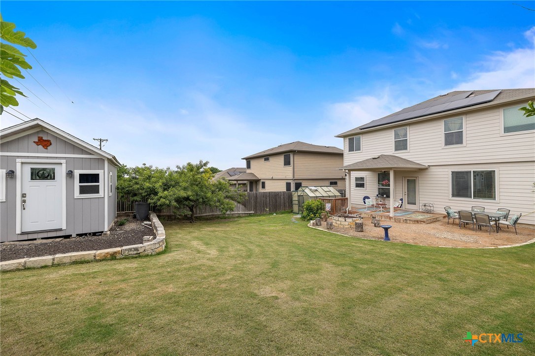 326 Comal Run Hutto, TX 78634 - Photo 22 of 23 a front view of house with outdoor seating and yard