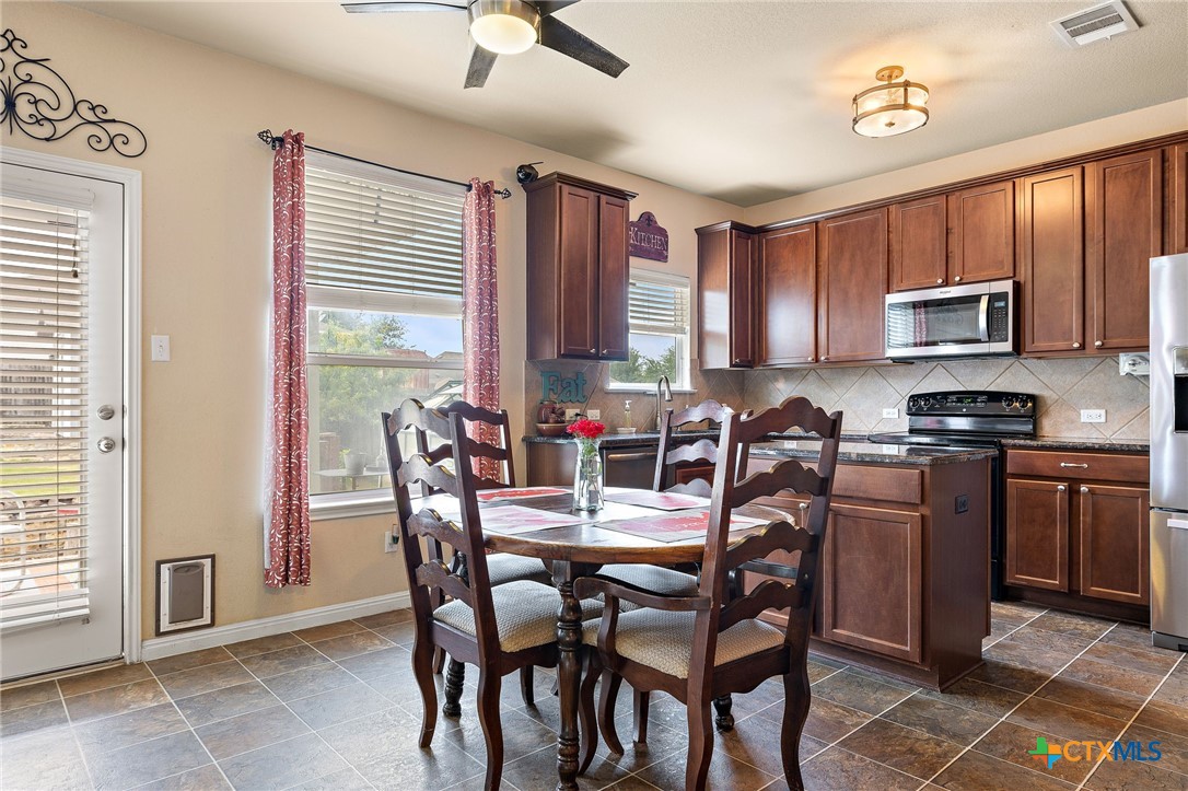 326 Comal Run Hutto, TX 78634 - Photo 6 of 23 a view of a dining room with furniture window and outside view