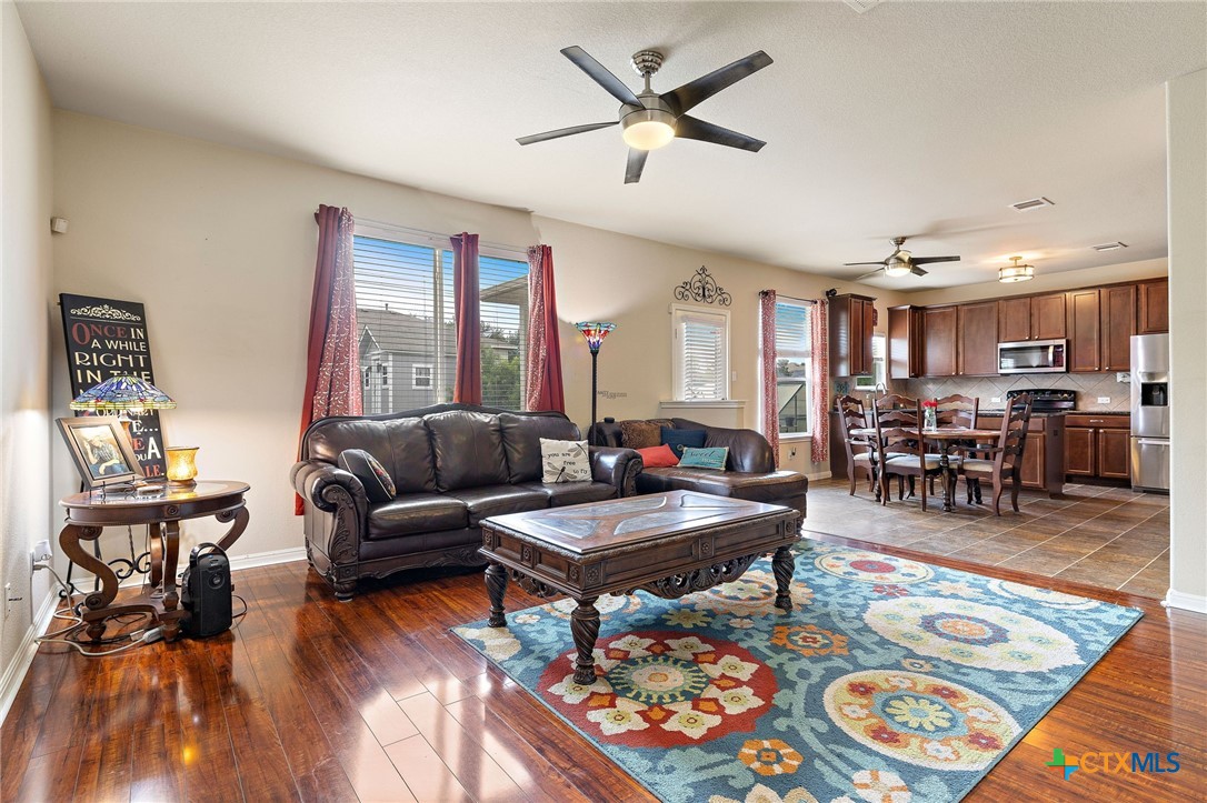 326 Comal Run Hutto, TX 78634 - Photo 10 of 23 a living room with furniture and wooden floor