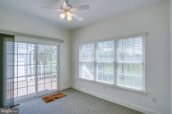 a view of an empty room with wooden roof
