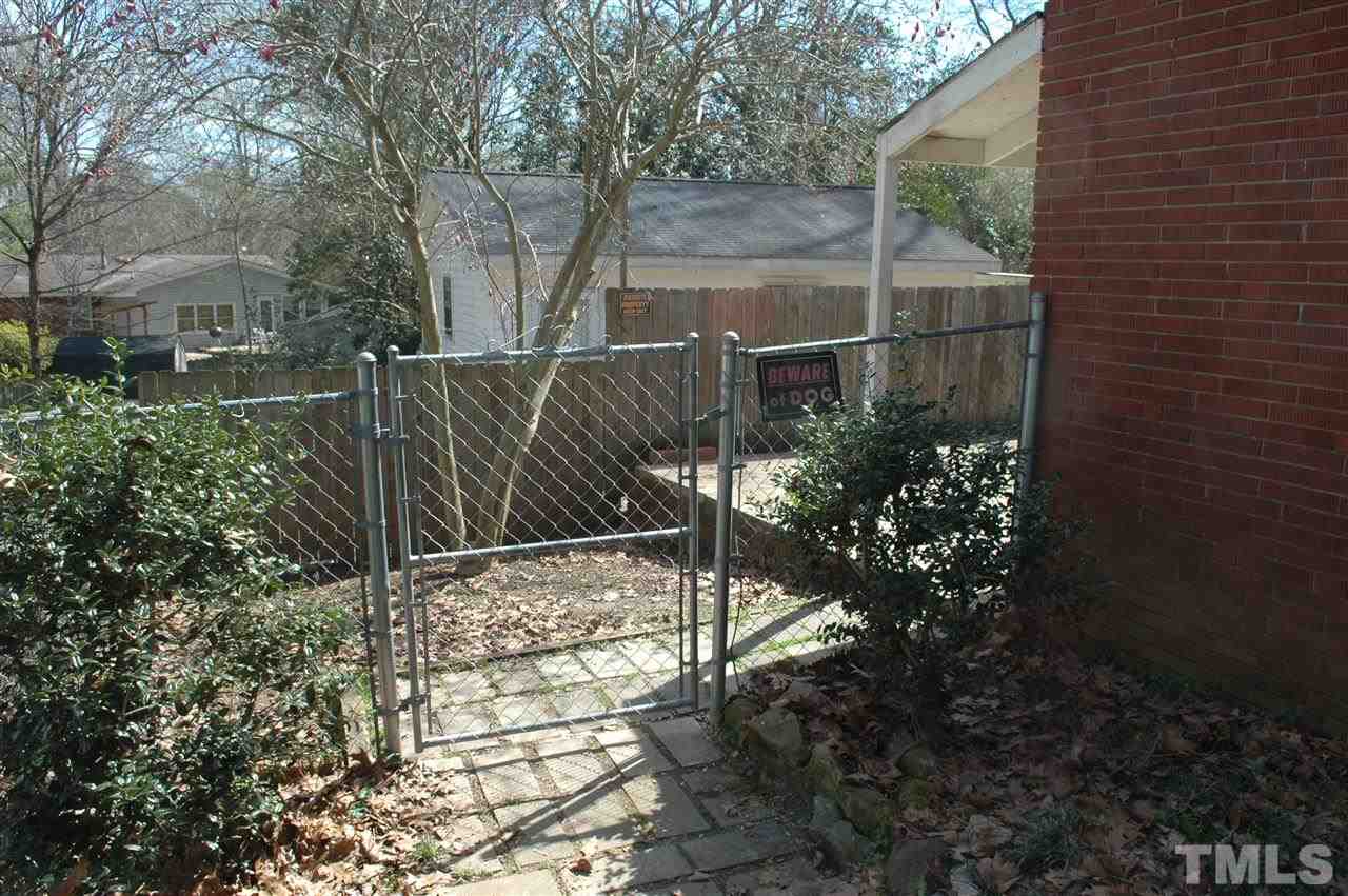 3208 Barker Place Raleigh, NC 27604 - Photo 7 of 10 Walkway leading to back yard/patio to exterior entrance to downstairs.