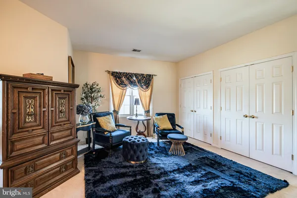 a bedroom with furniture and a window