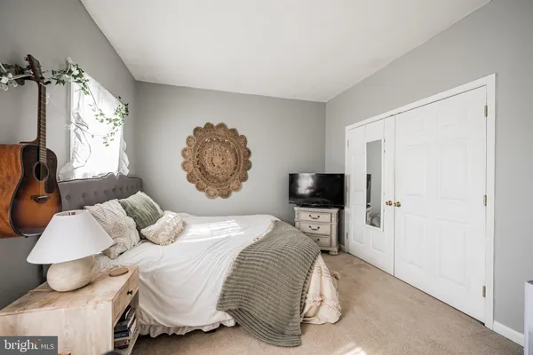 a bedroom with furniture and windows