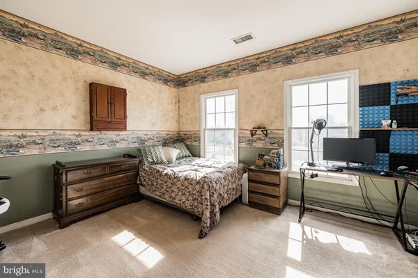 a bedroom with a bed and furniture