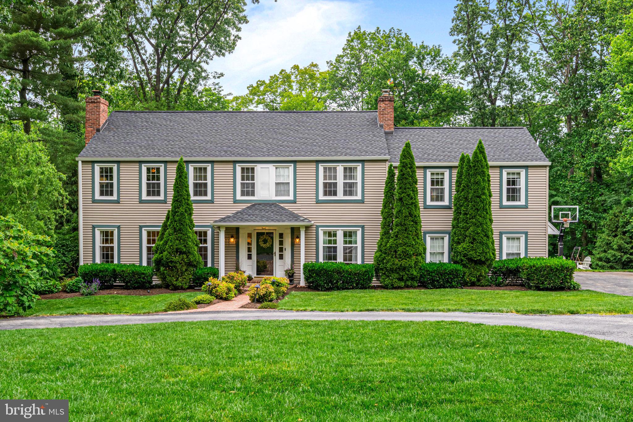 363 Colket Lane Wayne, PA 19087 - Photo 1 of 52 a front view of a house with garden and trees