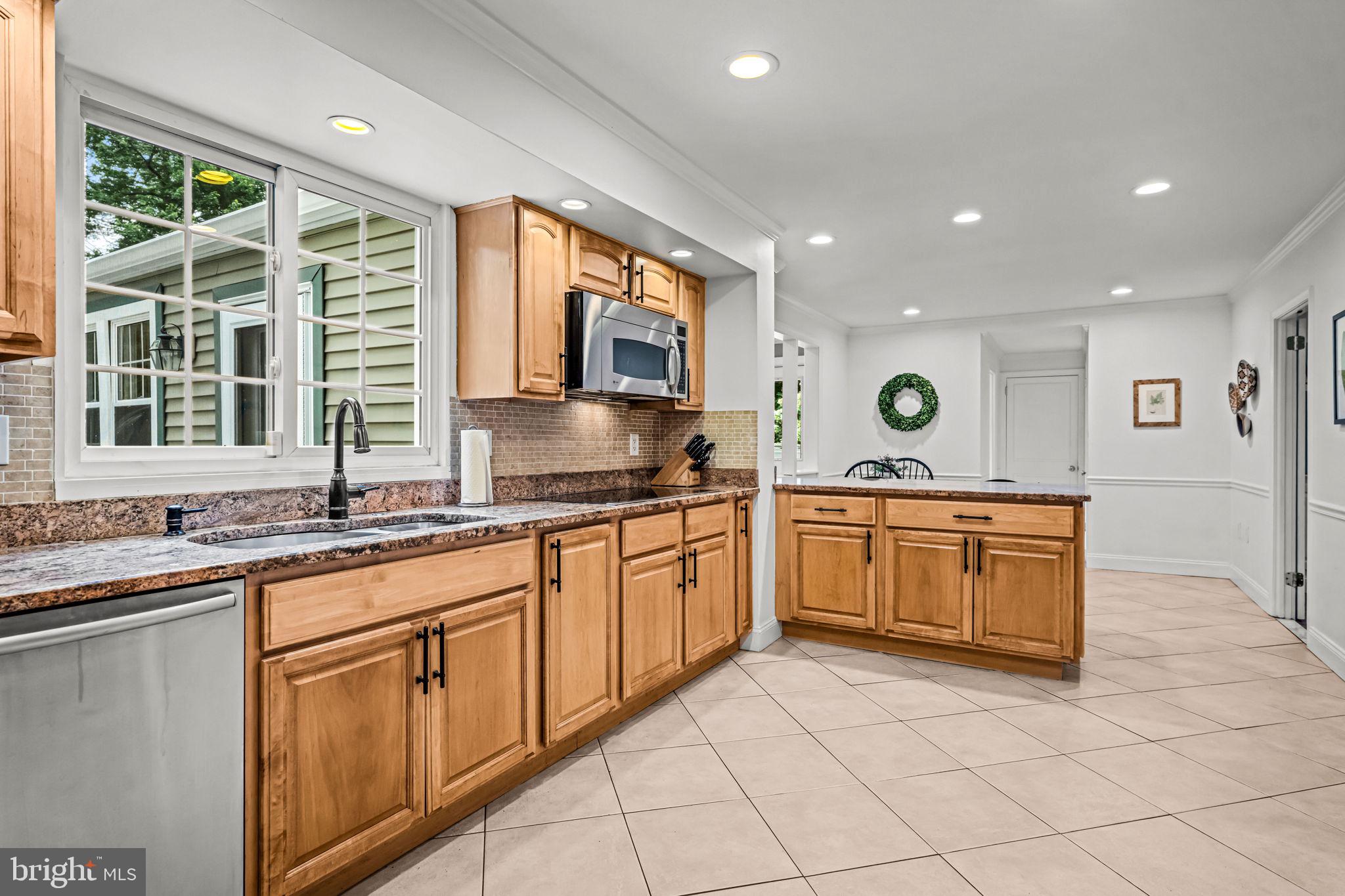 363 Colket Lane Wayne, PA 19087 - Photo 15 of 52 a kitchen with stainless steel appliances granite countertop a sink and a stove