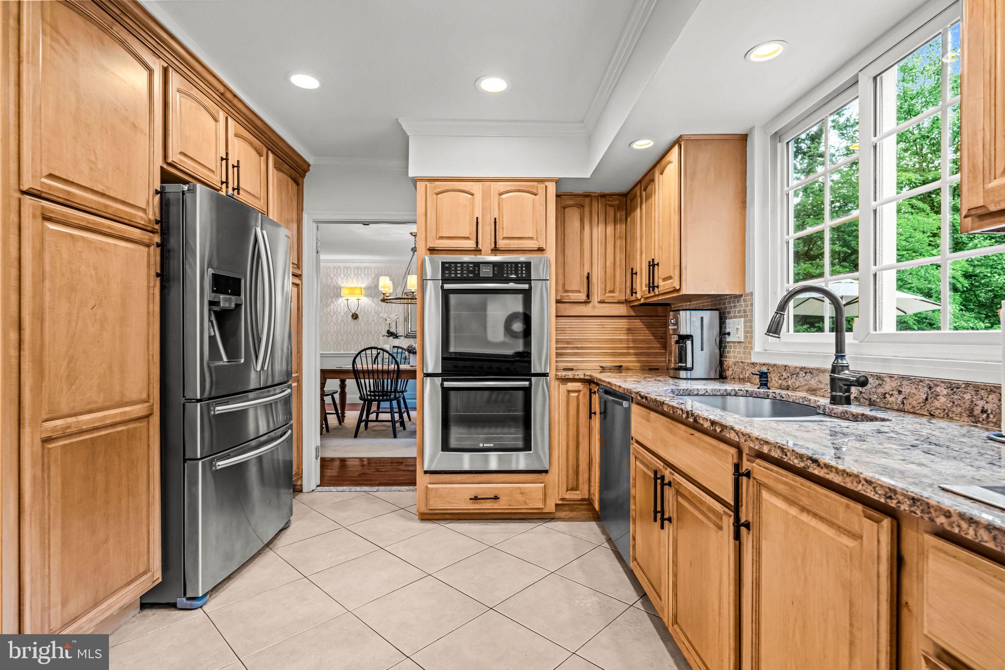 363 Colket Lane Wayne, PA 19087 - Photo 16 of 52 a kitchen with stainless steel appliances granite countertop a refrigerator and a sink