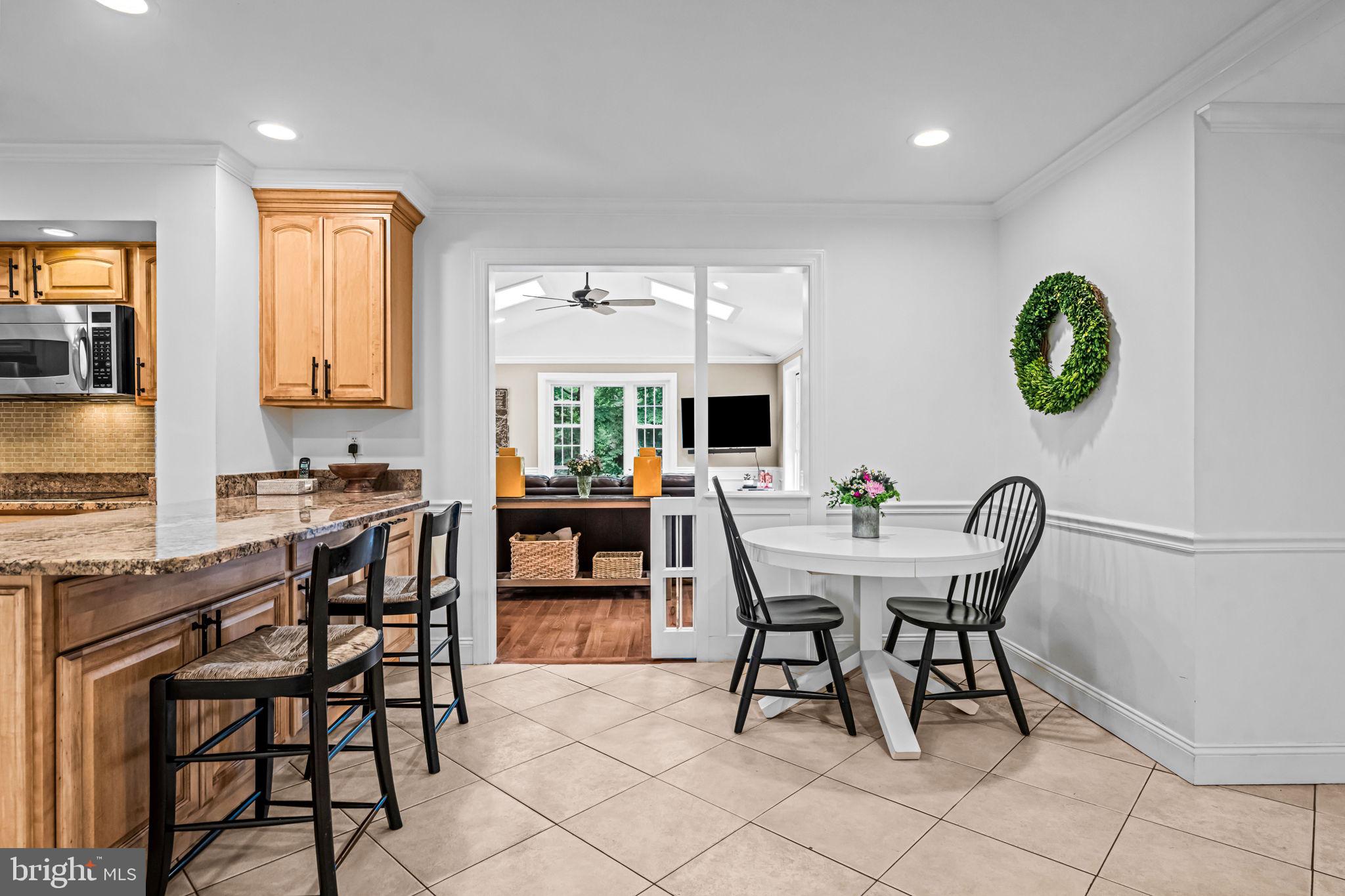 363 Colket Lane Wayne, PA 19087 - Photo 17 of 52 a view of a dining room and livingroom with furniture wooden floor and a rug