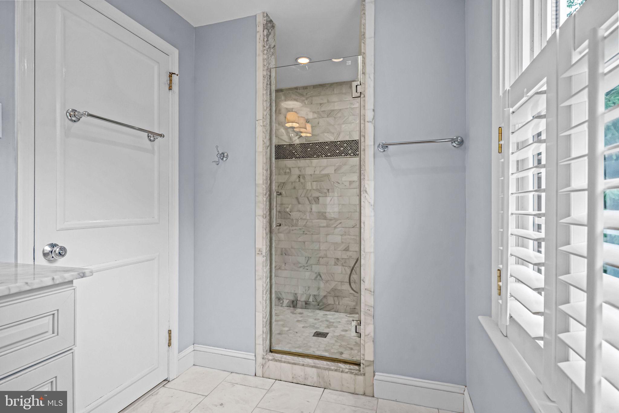 363 Colket Lane Wayne, PA 19087 - Photo 31 of 52 a bathroom with a glass shower door