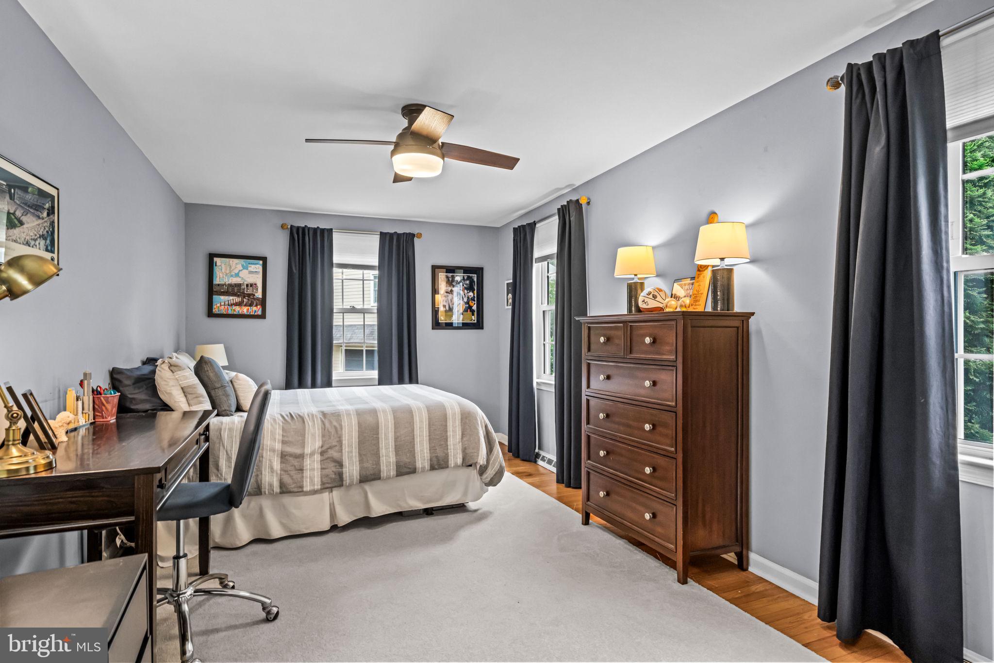 363 Colket Lane Wayne, PA 19087 - Photo 39 of 52 a bedroom with a bed and a chandelier