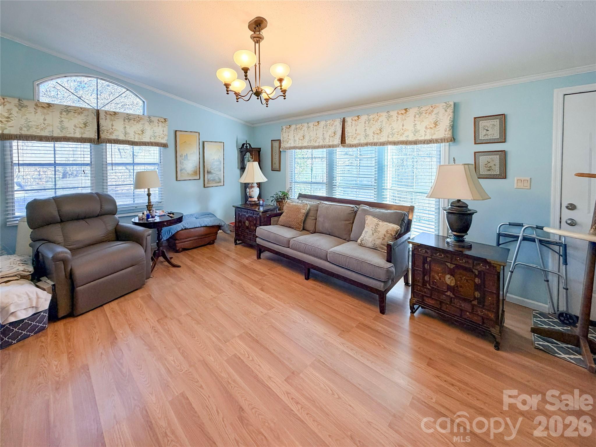 145 Goneaway Lane Cleveland, NC 27013 - Photo 3 of 12 a living room with furniture and a chandelier