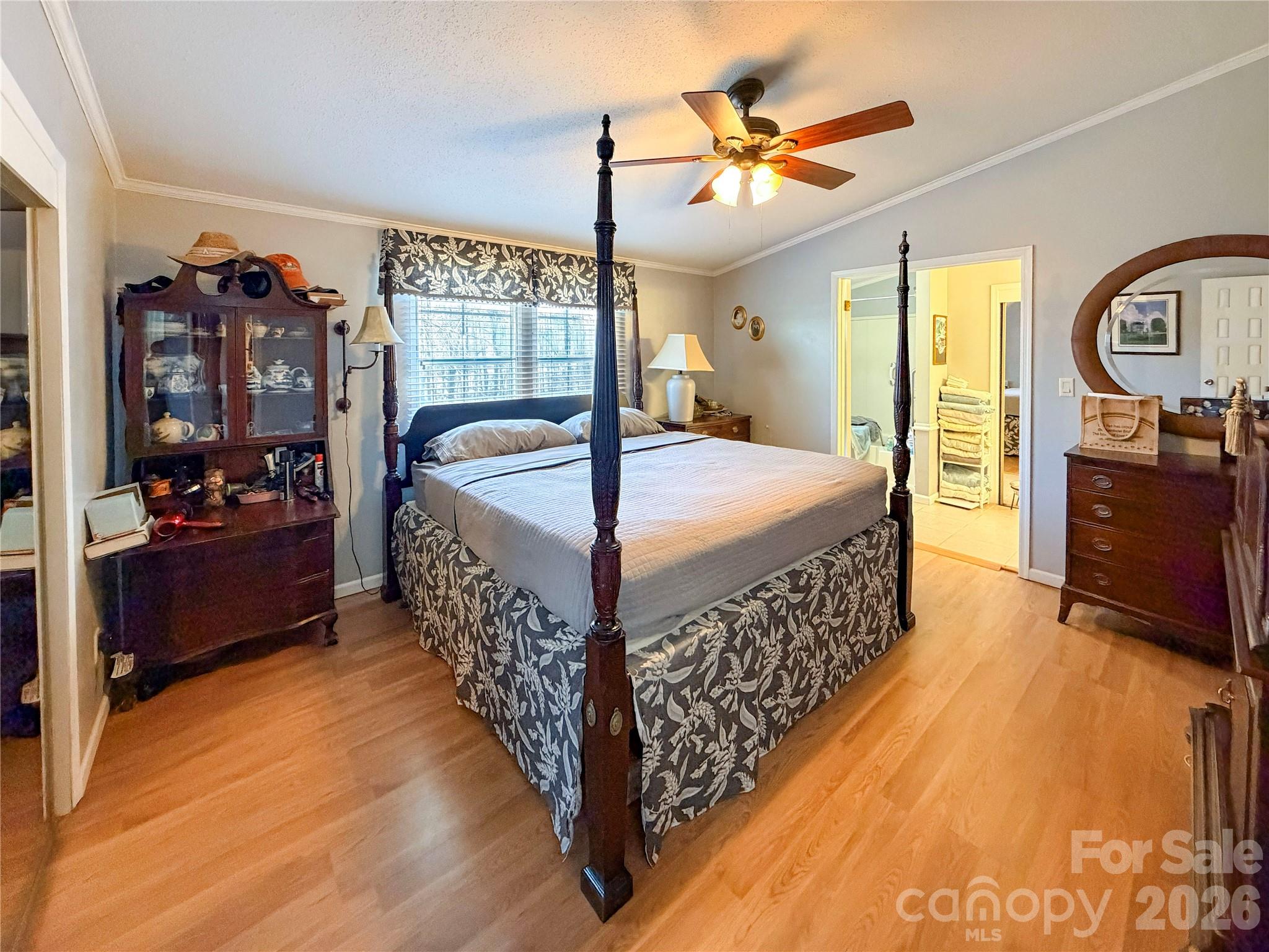 145 Goneaway Lane Cleveland, NC 27013 - Photo 7 of 12 a bed room with a bed and a chandelier