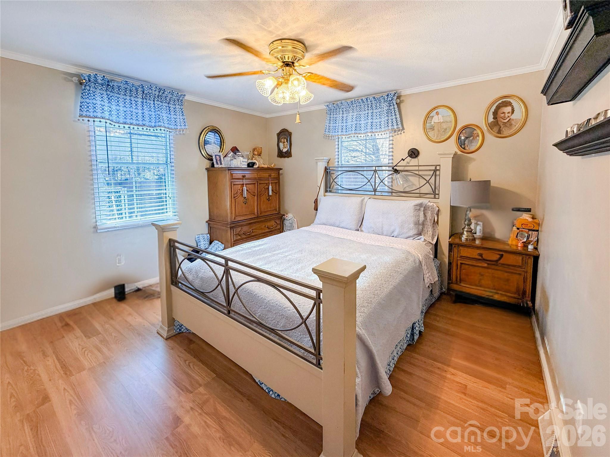 145 Goneaway Lane Cleveland, NC 27013 - Photo 10 of 12 a bedroom with a bed and a chandelier