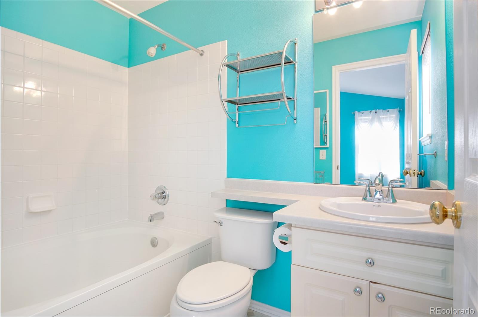 9688 Queenscliffe Drive Highlands Ranch, CO 80130 - Photo 24 of 34 a bathroom with a sink a toilet and shower