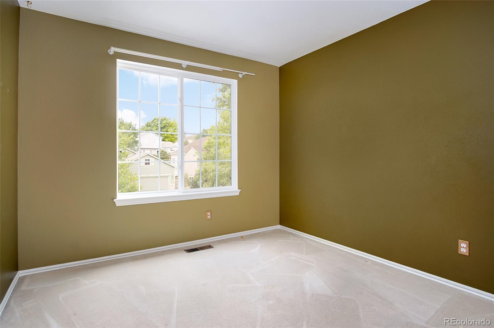 9688 Queenscliffe Drive Highlands Ranch, CO 80130 - Photo 27 of 34 a view of an empty room with a window
