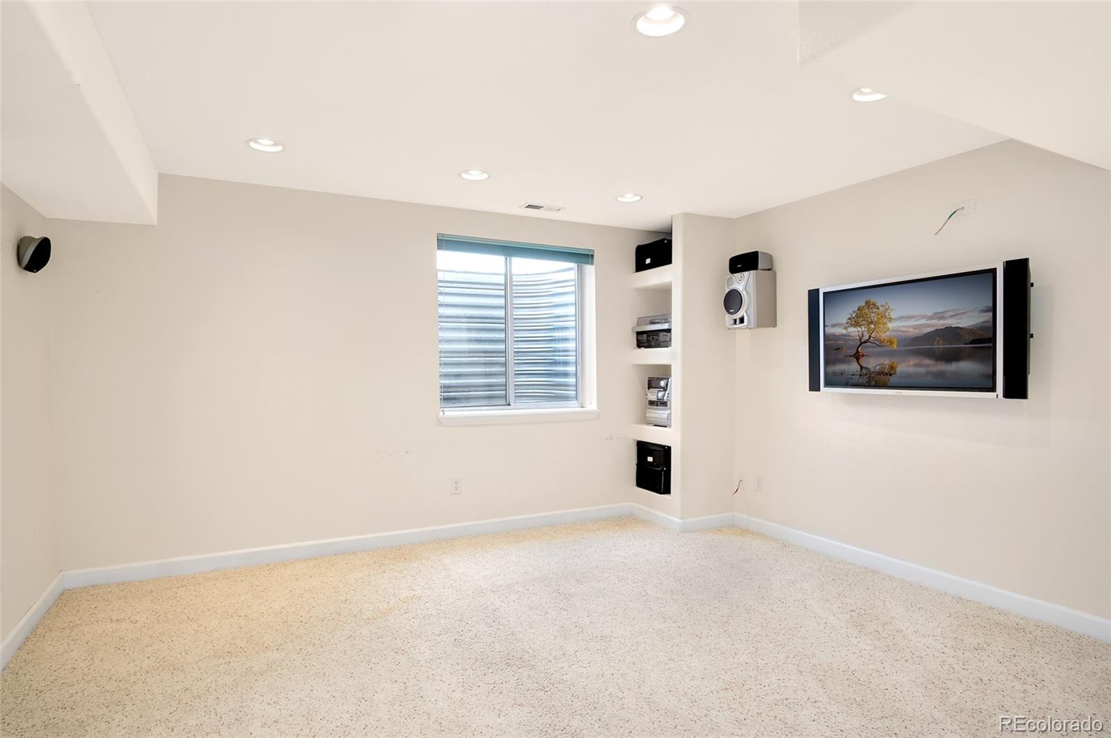 9688 Queenscliffe Drive Highlands Ranch, CO 80130 - Photo 5 of 34 an empty room with windows