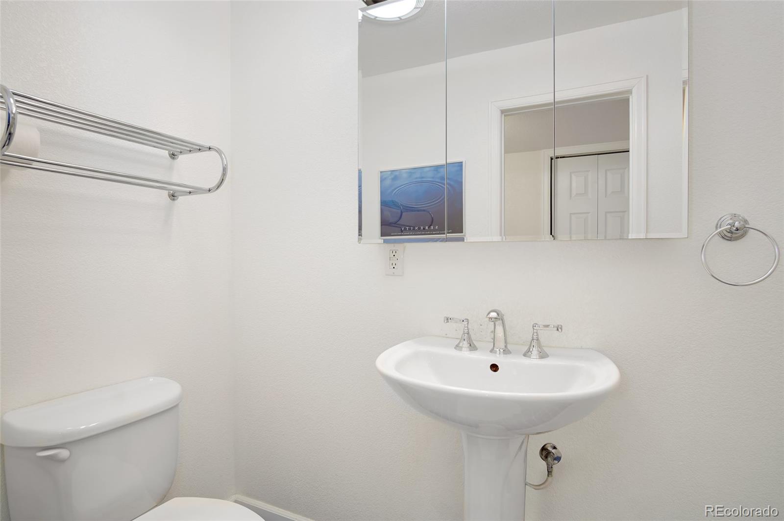 9688 Queenscliffe Drive Highlands Ranch, CO 80130 - Photo 9 of 34 a bathroom with a sink a toilet and shower