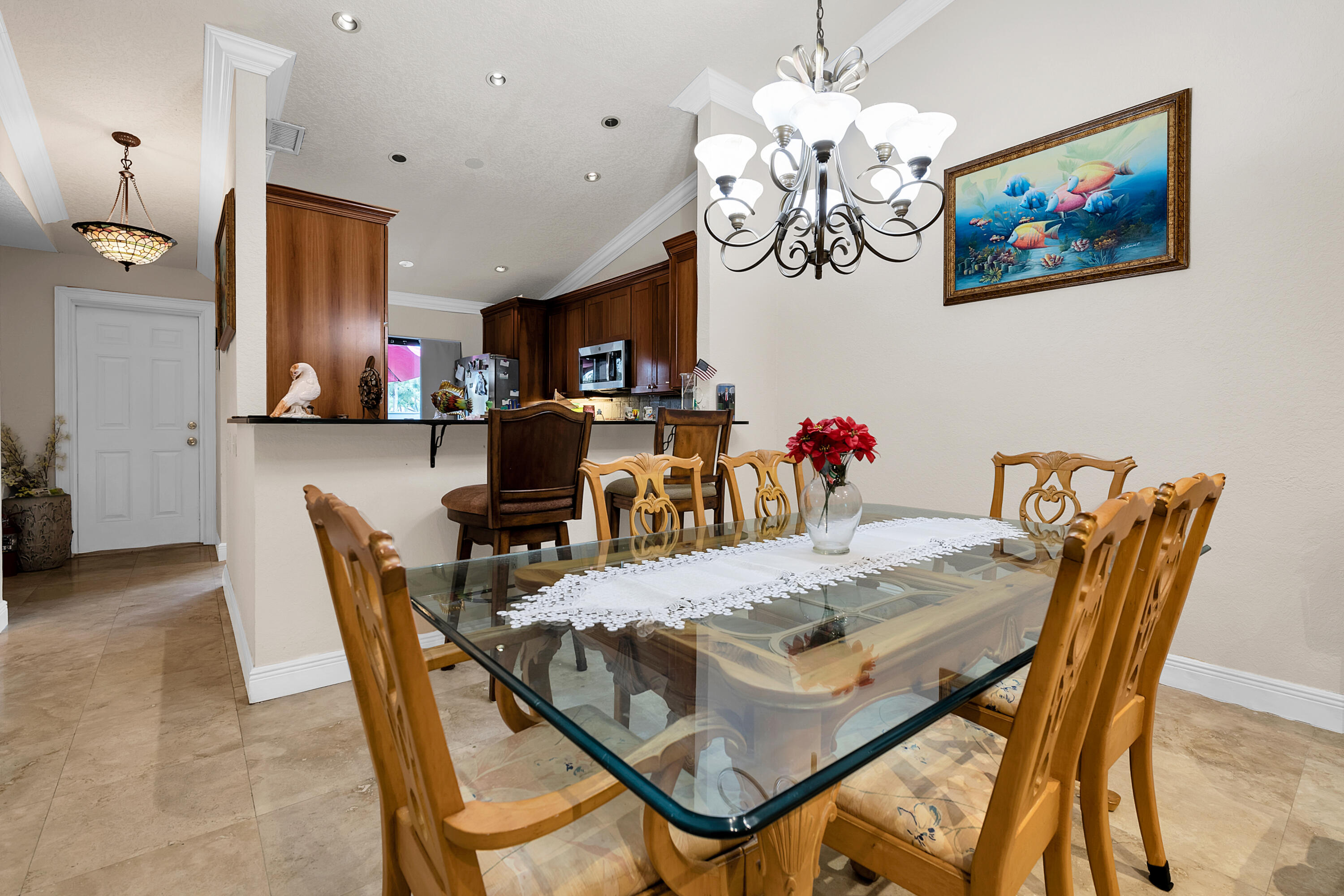 8440 Boca Glades Boulevard East Boca Raton, FL 33434 - Photo 5 of 16 a view of a dining room with furniture