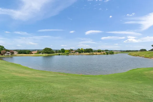a view of a lake with a city