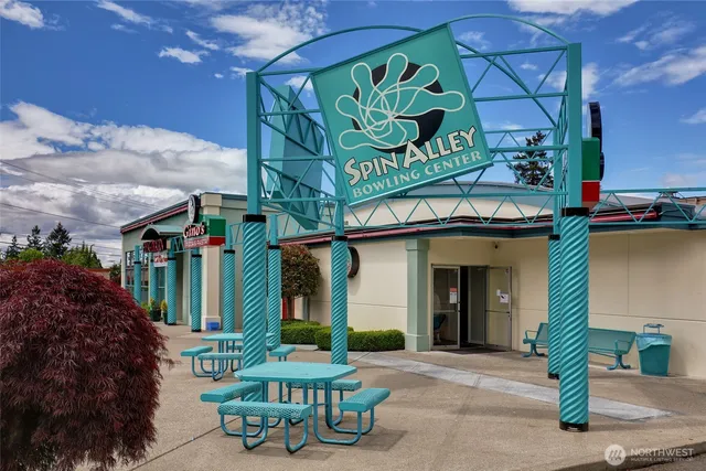 a view of a cafe with sitting area