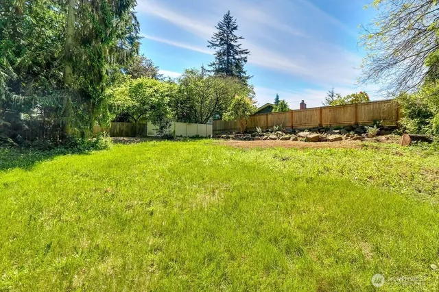 a view of a garden with a house