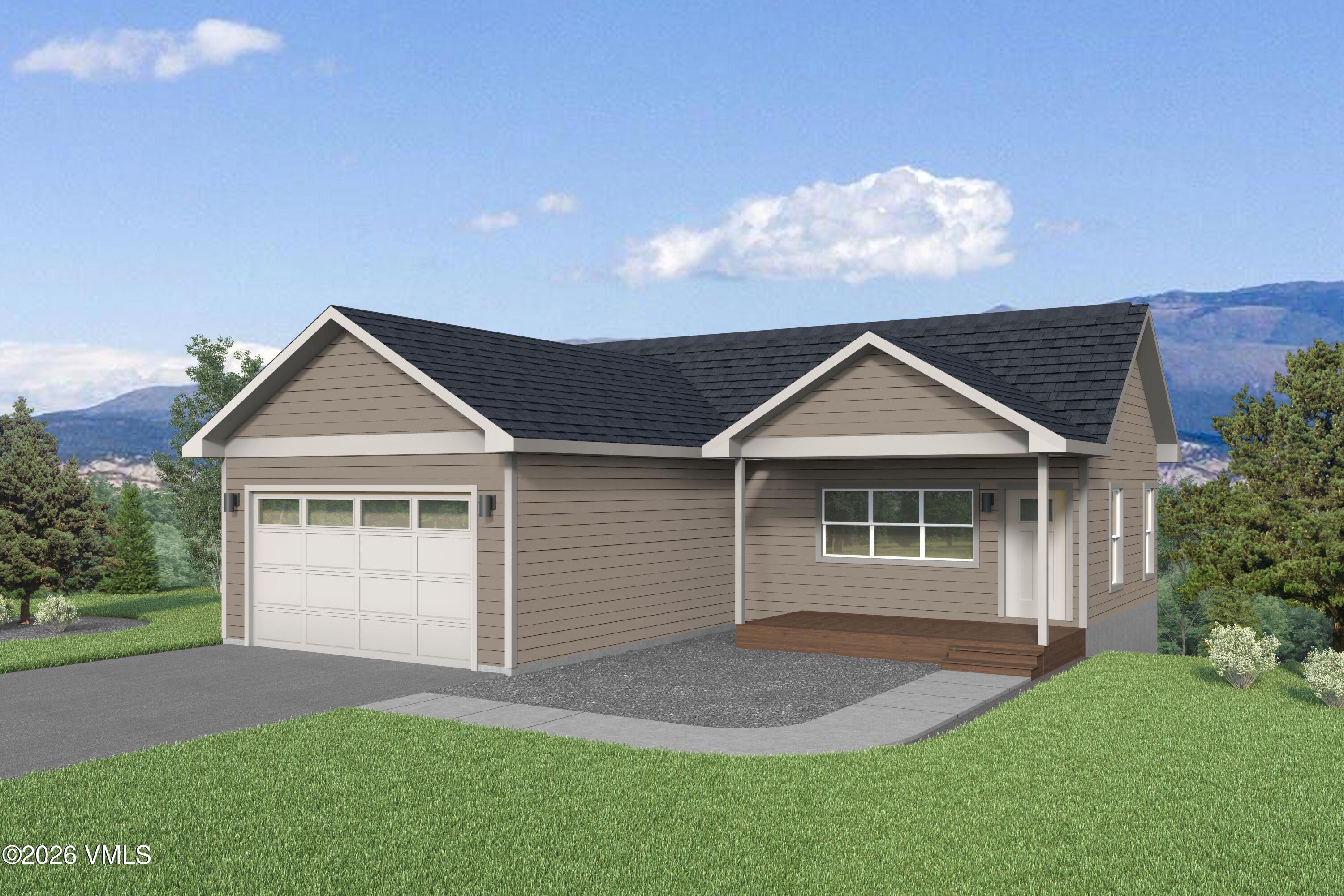 525 Blackhawk Road Gypsum, CO 81637 - Photo 1 of 23 a front view of a house with a yard and garage