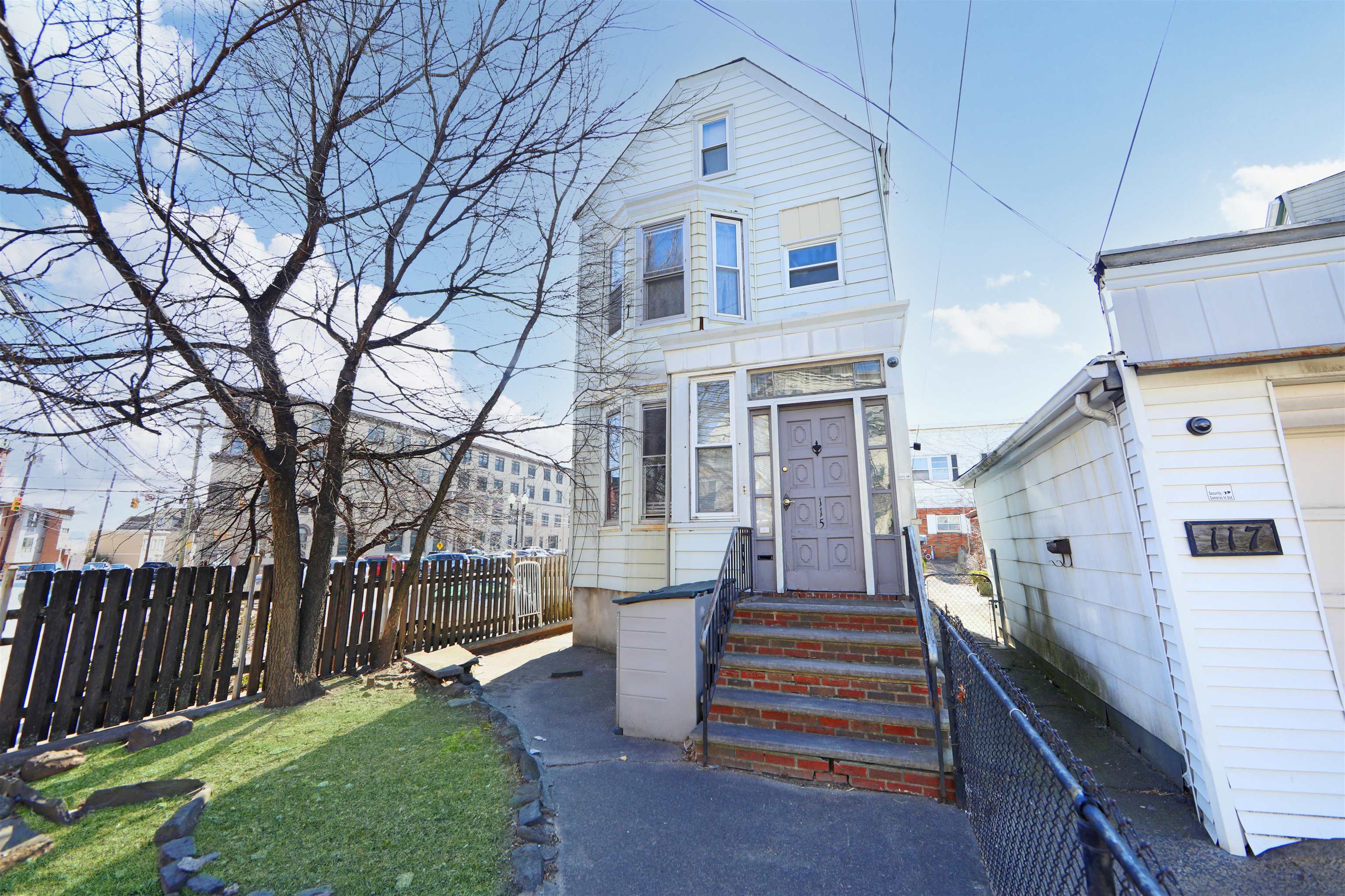 115-117 Hackensack Plank Road Weehawken, NJ 07086 - Photo 21 of 43 a front view of a house with a yard