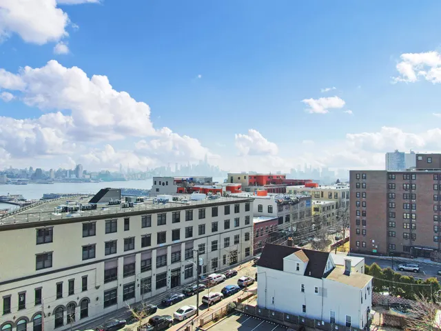 a view of a city with tall buildings