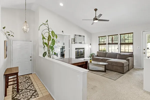 a living room with furniture and a window