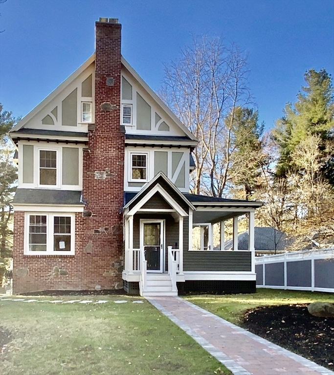 59 Beechmont Street Worcester, MA 01609 - Photo 2 of 39 a front view of a house with a yard