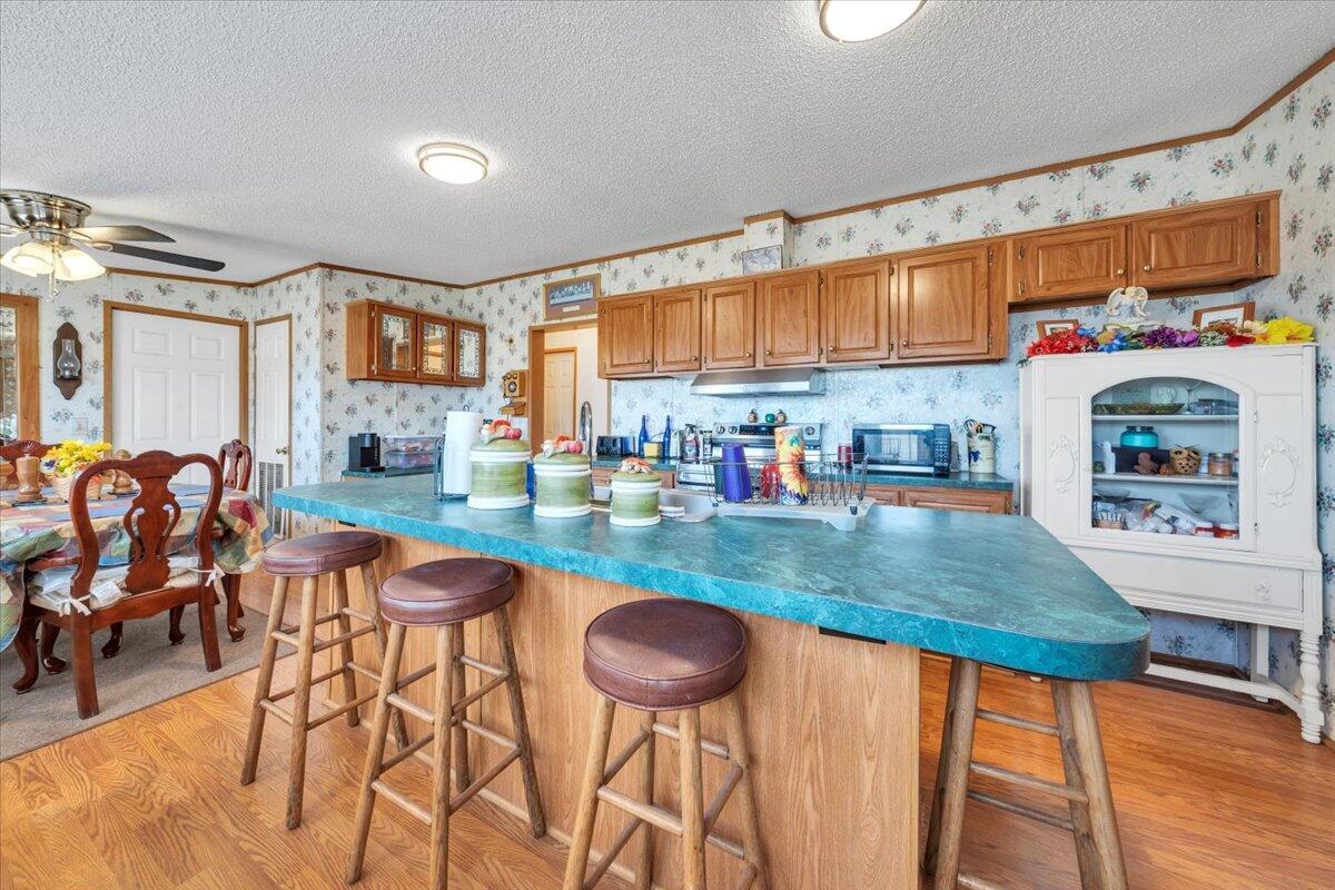 1421 Mob Creek Road Bedford, VA 24523 - Photo 11 of 44 a kitchen with stainless steel appliances granite countertop a sink and a refrigerator