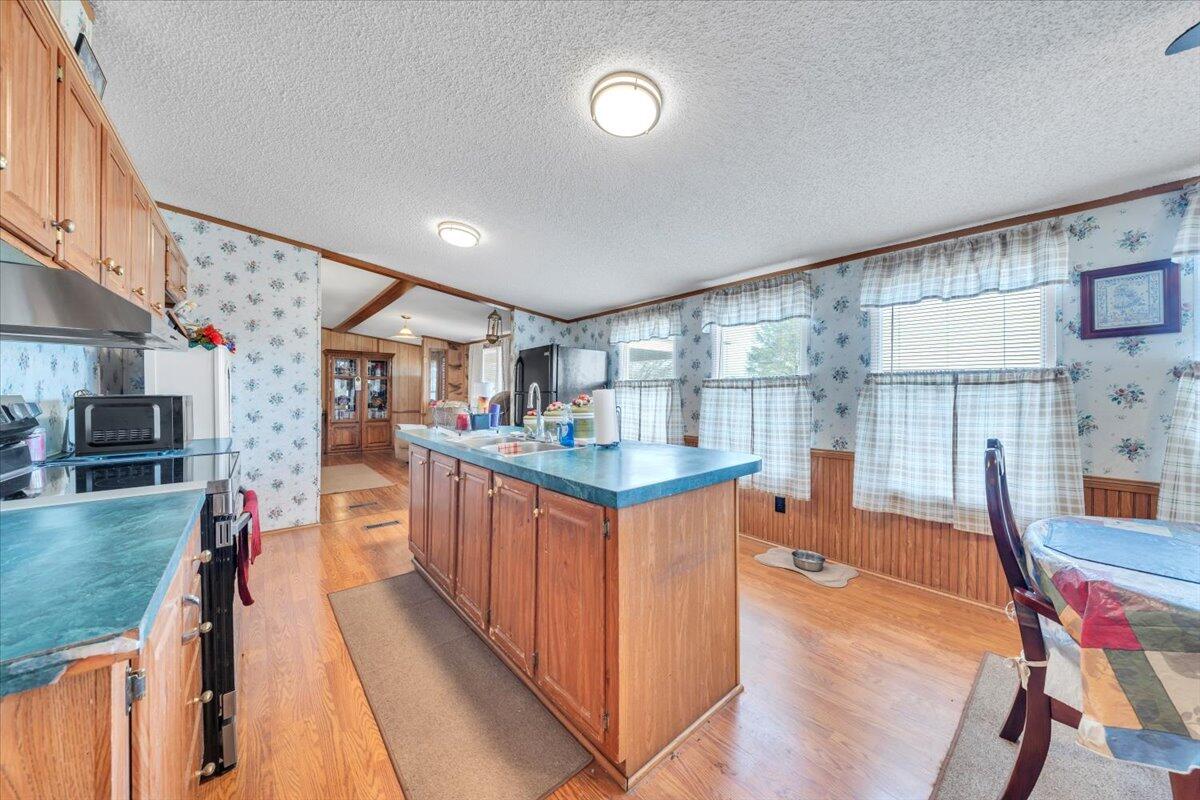 1421 Mob Creek Road Bedford, VA 24523 - Photo 13 of 44 a kitchen with stainless steel appliances granite countertop lots of counter top space