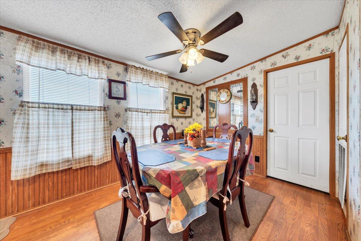 1421 Mob Creek Road Bedford, VA 24523 - Photo 15 of 44 a view of a dining room with furniture window and wooden floor
