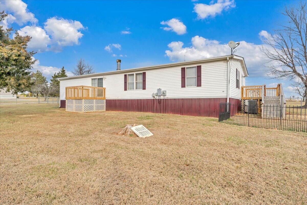 1421 Mob Creek Road Bedford, VA 24523 - Photo 37 of 44 a view of a house with a backyard and a tree