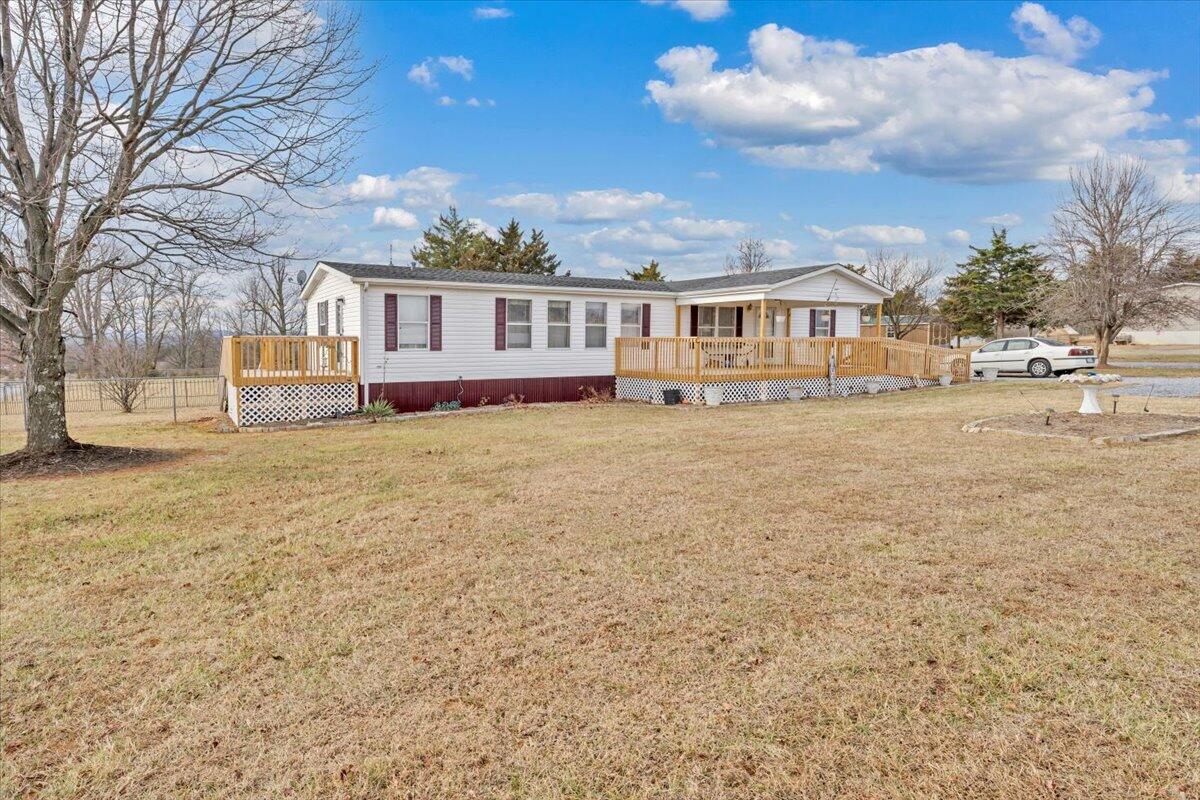 1421 Mob Creek Road Bedford, VA 24523 - Photo 38 of 44 a view of a big house with a big yard and large trees