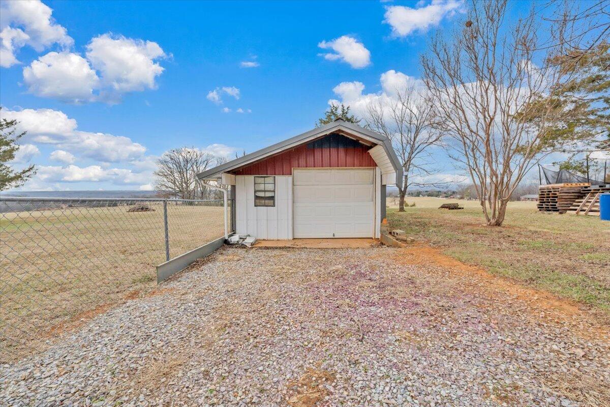 1421 Mob Creek Road Bedford, VA 24523 - Photo 40 of 44 a view of a house with a yard and garage