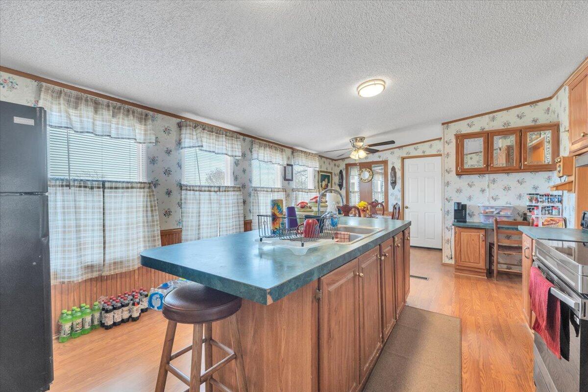 1421 Mob Creek Road Bedford, VA 24523 - Photo 10 of 44 a kitchen with counter top space and wooden floor