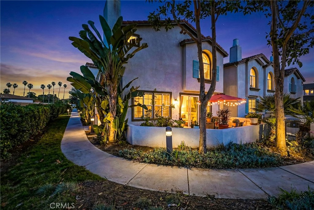 310 Sunset Way, Unit 5 Oceanside, CA 92058 - Photo 1 of 41 a front view of a house with a yard and fountain
