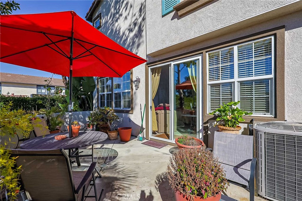310 Sunset Way, Unit 5 Oceanside, CA 92058 - Photo 20 of 41 a view of a house with backyard sitting area and garden