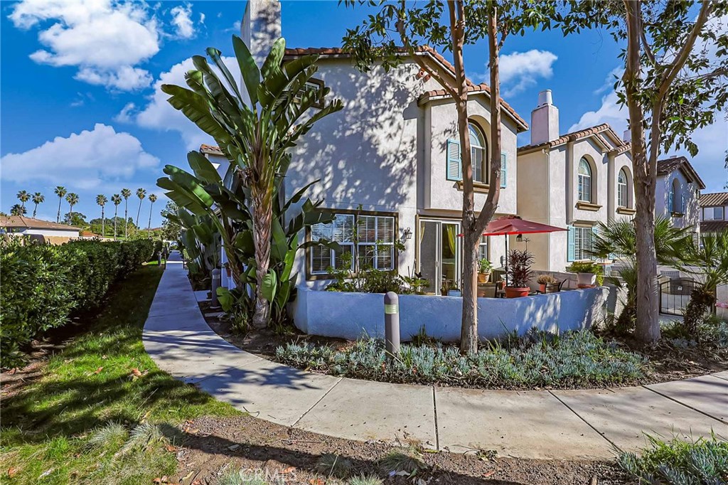 310 Sunset Way, Unit 5 Oceanside, CA 92058 - Photo 2 of 41 a house with lots of trees