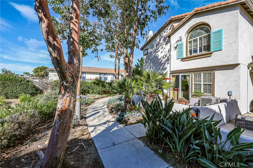 310 Sunset Way, Unit 5 Oceanside, CA 92058 - Photo 31 of 41 a front view of a house with garden