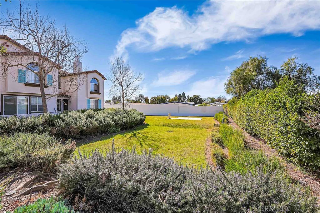 310 Sunset Way, Unit 5 Oceanside, CA 92058 - Photo 32 of 41 a view of a lake with a house in the background