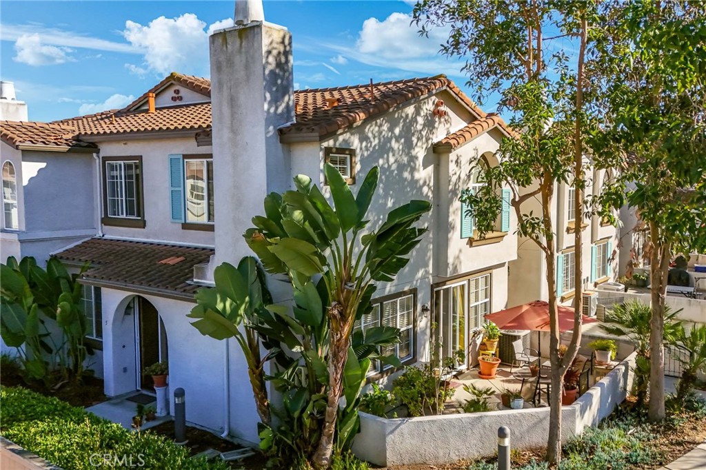 310 Sunset Way, Unit 5 Oceanside, CA 92058 - Photo 33 of 41 a front view of a house with garden