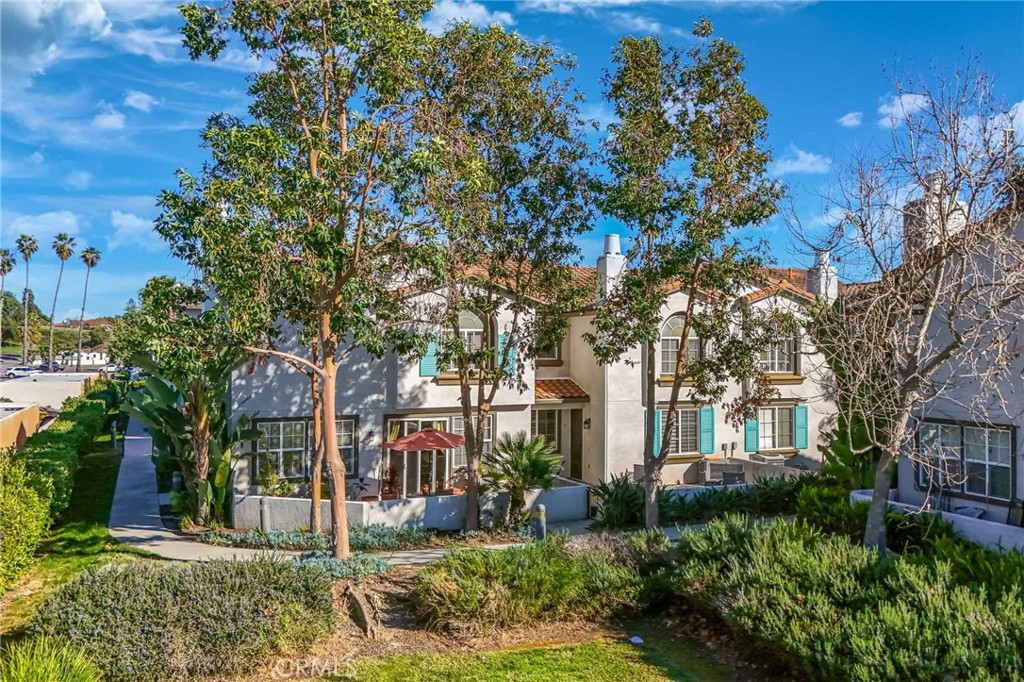 310 Sunset Way, Unit 5 Oceanside, CA 92058 - Photo 34 of 41 a front view of a house with a tree