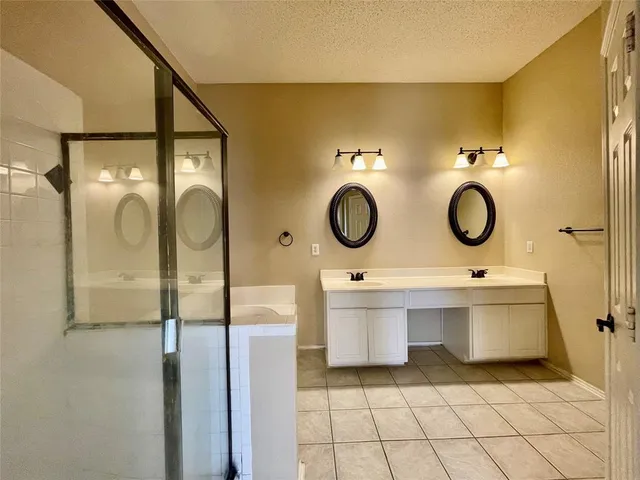a bathroom with a sink mirror vanity and toilet