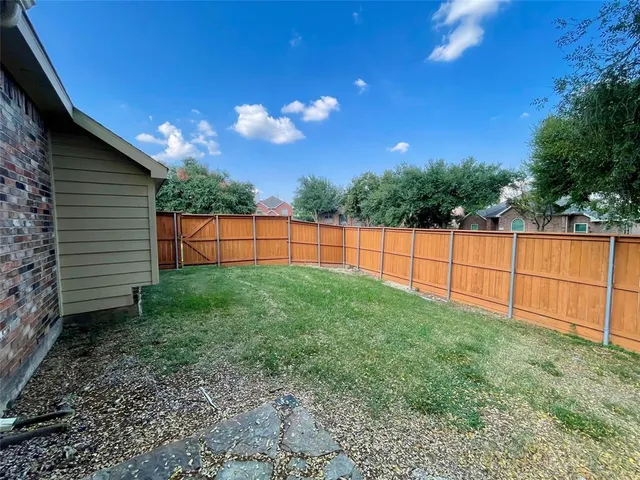 a view of backyard with green space