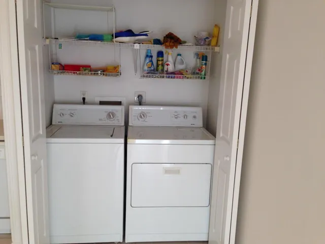 a utility room with dryer and washer